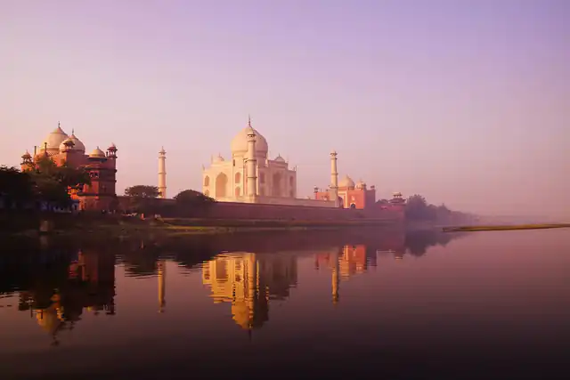 Taj Mahal at dawn reflected in the Yamuna River, Agra